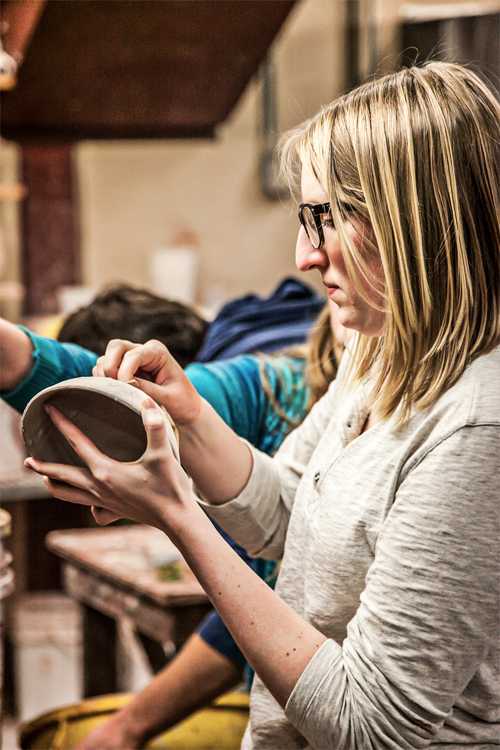 Student working on ceramics piece