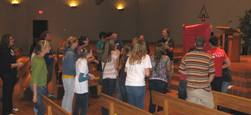 Outreach teams singing during mock lock-in
