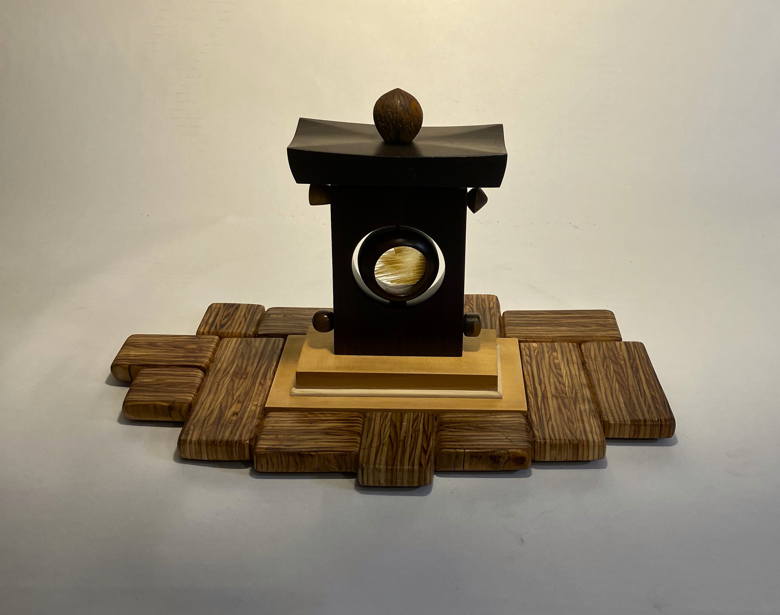 Darrel Nelson, “Nearly Zen,” rosewood, pine, plywood, walnut shell, mixed hardwood, 2025
