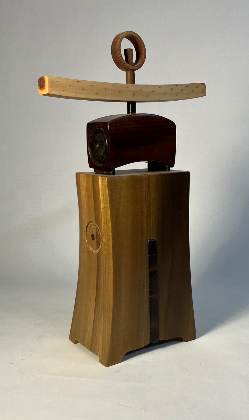 Darrel Nelson, “Pine Shrine,” ponderosa pine branch, mixed wood, 2024
