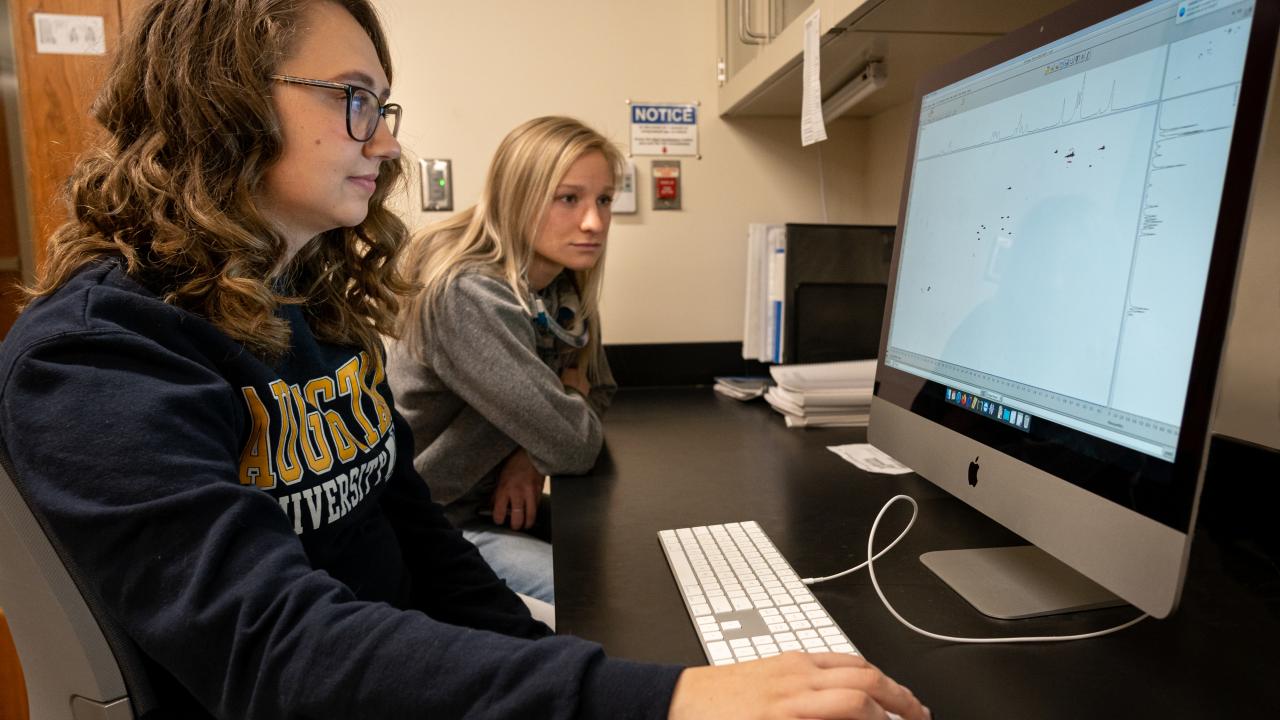 students looking at data on computer