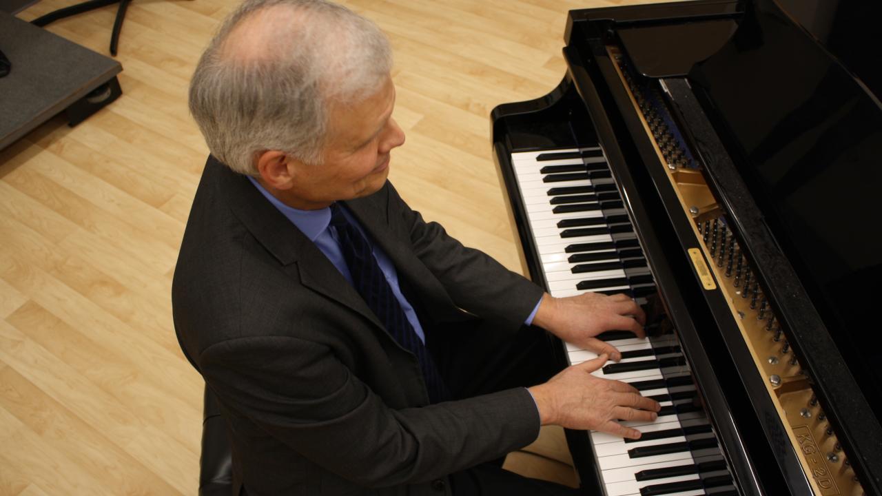 Paul Nesheim playing piano