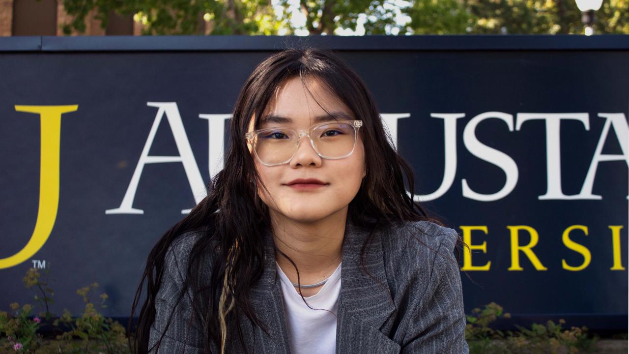 Harley in Front of Augustana University Sign