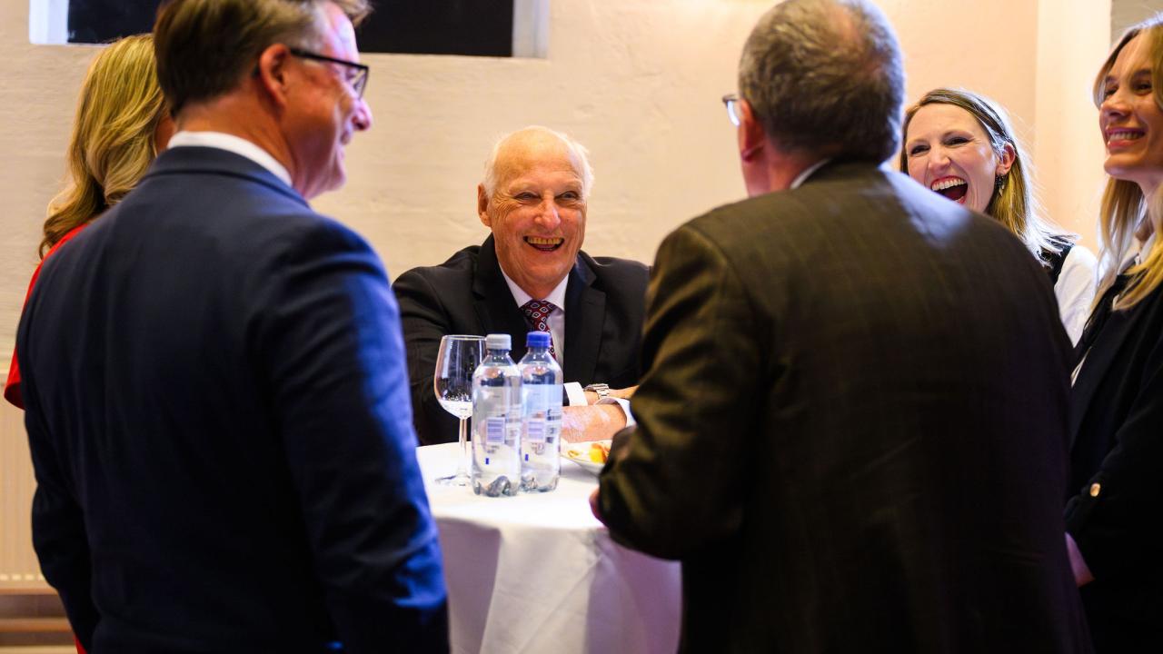 King Speaking With University Members