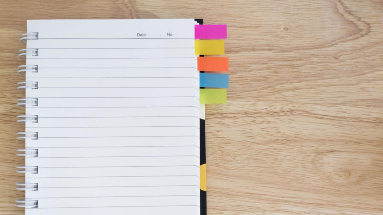 Empty notebook with sticky notes