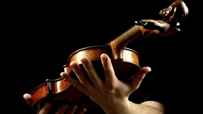 Student holds violin